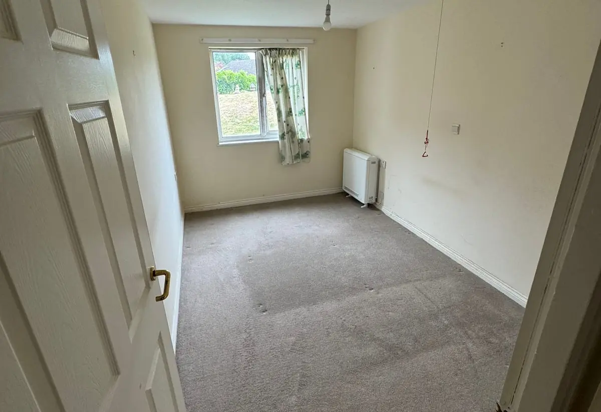 An empty bedroom after a house clearance in East Yorkshire
